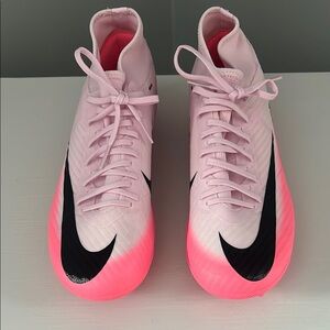 Nike Pink Athletic Shoes with High-Top Design and Textured Upper